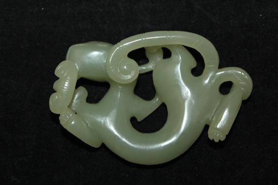 A Chinese celadon jade carving of a chi-dragon biting a sprig of lingzhi fungus, Qing dynasty, 6.9cm